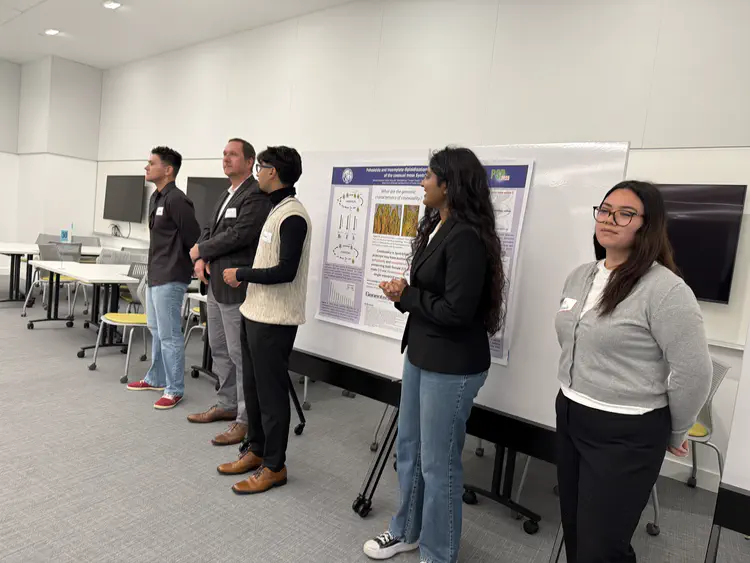 The team with their poster at the symposium!